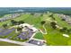 Aerial view featuring golf course and community amenities, set against a lush green backdrop at 3161 Timberly Ln, Lakeland, FL 33810