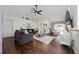 Open-concept living area with hardwood flooring, comfortable seating, and a bright atmosphere at 3161 Timberly Ln, Lakeland, FL 33810