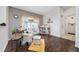 Cozy seating area with a white armchair, decorative pillows, and warm, natural light at 3161 Timberly Ln, Lakeland, FL 33810