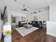 Open-concept living area with hardwood flooring, comfortable seating, and a bright atmosphere at 3161 Timberly Ln, Lakeland, FL 33810
