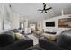 Spacious living room featuring a neutral color scheme, wood floors, and modern furnishings at 3161 Timberly Ln, Lakeland, FL 33810