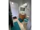 Cozy bathroom with a single sink, a tan granite countertop, and tile flooring at 324 Palermo St, Davenport, FL 33897