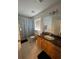 Bright bathroom featuring tiled floors, shower and bath, with a light wood vanity at 324 Palermo St, Davenport, FL 33897
