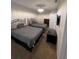 Inviting bedroom featuring carpeted floors, a ceiling fan and two beds that fill the space at 324 Palermo St, Davenport, FL 33897