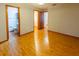 Well-lit main bedroom with hardwood floors and direct access to bathroom at 3267 Villa Way Cir, St Cloud, FL 34769