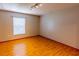 Comfortable bedroom with natural light and laminate flooring, offering space for relaxation at 3267 Villa Way Cir, St Cloud, FL 34769