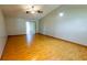 Spacious living room features a sliding glass door and light wood laminate flooring at 3267 Villa Way Cir, St Cloud, FL 34769