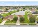 Aerial view of a home in a residential area with a scenic pond and lush green surroundings at 3335 Whistling Trl, St Cloud, FL 34772