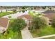 Beautiful aerial view of a house in a residential neighborhood next to a lake at 3335 Whistling Trl, St Cloud, FL 34772