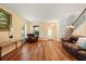 Inviting living room featuring hardwood floors, natural light, and neutral decor, ideal for relaxing at 3335 Whistling Trl, St Cloud, FL 34772