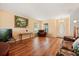 Bright living room with hardwood floors, and comfortable seating, creating a welcoming space at 3335 Whistling Trl, St Cloud, FL 34772