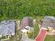 Birds-eye view of a well maintained home, landscaping, and screened-in pool enclosure at 341 Whittier St, Davenport, FL 33896