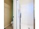 Bathroom with shower with glass doors and a neutral tile floor at 341 Whittier St, Davenport, FL 33896