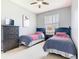 Bedroom with two twin beds and a dresser at 341 Whittier St, Davenport, FL 33896