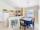 Kitchen with a dining area, barstool seating, and tile floors at 341 Whittier St, Davenport, FL 33896