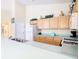 Bright kitchen featuring wooden cabinets, neutral countertops, and modern appliances for a functional cooking space at 341 Whittier St, Davenport, FL 33896