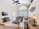 Bright living room with tile floors, high ceilings, comfortable seating, and pool view at 341 Whittier St, Davenport, FL 33896