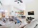 Spacious living room featuring tile floors, vaulted ceilings, and comfortable seating arrangements at 341 Whittier St, Davenport, FL 33896