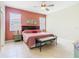 Spacious main bedroom with ceiling fan, tile floor, en-suite bathroom and walk-in closet at 341 Whittier St, Davenport, FL 33896