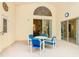 Outdoor patio showcases table and chairs, sliding glass doors, and neutral color scheme at 341 Whittier St, Davenport, FL 33896