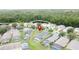Lovely aerial view of the homes in this residential neighborhood featuring screened pools and mature trees at 350 Scrub Jay Way, Davenport, FL 33896
