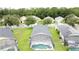 An aerial view of a backyard with a screened-in pool and conservation view at 350 Scrub Jay Way, Davenport, FL 33896