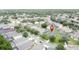 An aerial image displays a residential area with single-Gathering homes, green lawns, and tree-lined streets at 350 Scrub Jay Way, Davenport, FL 33896