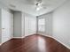 Bedroom with hardwood floors, natural lighting, a closet, and a ceiling fan at 350 Scrub Jay Way, Davenport, FL 33896