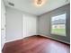 This bedroom has nice wood floors and a good source of natural light from the window at 350 Scrub Jay Way, Davenport, FL 33896