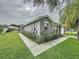 Stylish home featuring a neutral stucco exterior and well-maintained landscaping on a corner lot at 350 Scrub Jay Way, Davenport, FL 33896