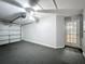 This garage has a ceiling fan, door to the outside, and electric garage door at 350 Scrub Jay Way, Davenport, FL 33896