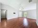 Spacious living room features wood floors, ceiling fan, and lots of natural light at 350 Scrub Jay Way, Davenport, FL 33896