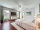 Bright main bedroom with hardwood floors, large windows, and modern decor providing a comfortable space at 350 Scrub Jay Way, Davenport, FL 33896