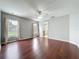 Spacious main bedroom with hardwood floors and natural light, creating a serene and inviting atmosphere at 350 Scrub Jay Way, Davenport, FL 33896