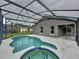 Beautiful screened-in pool and spa with patio, ideal for outdoor living and enjoying the sunshine at 350 Scrub Jay Way, Davenport, FL 33896