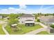 Expansive fenced backyard featuring a screened lanai, a playset, and lush green grass at 3859 Spirited Cir, St Cloud, FL 34772