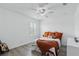 Cozy bedroom features white walls, and a comfortable bed with decorative pillows and a soft blanket at 3859 Spirited Cir, St Cloud, FL 34772