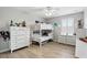 Bedroom featuring bunkbeds, dresser and natural light from window at 3859 Spirited Cir, St Cloud, FL 34772