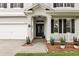 Inviting front porch with decorative columns and a neatly landscaped entrance at 3859 Spirited Cir, St Cloud, FL 34772