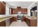 Well-equipped kitchen with stainless steel appliances, granite countertops, and ample cabinet space at 3859 Spirited Cir, St Cloud, FL 34772