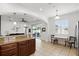 Kitchen with granite countertops and breakfast bar overlooks living area at 3859 Spirited Cir, St Cloud, FL 34772