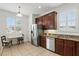 Well-lit kitchen with stainless steel appliances, granite countertops, and ample cabinet space at 3859 Spirited Cir, St Cloud, FL 34772
