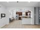 Open kitchen with stainless steel appliances, wood cabinets, and tile floors at 3859 Spirited Cir, St Cloud, FL 34772