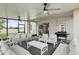 Relaxing screened lanai furnished with a dining set, lounge chairs, and a grill, ideal for entertaining at 3859 Spirited Cir, St Cloud, FL 34772