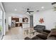Open-concept living room flows seamlessly into the kitchen at 3859 Spirited Cir, St Cloud, FL 34772