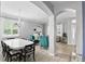 Spacious living area with stylish seating, piano, chandelier and an open floor plan at 3859 Spirited Cir, St Cloud, FL 34772
