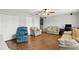 Relaxing living room featuring ample seating, natural light and hardwood floors at 3859 Spirited Cir, St Cloud, FL 34772