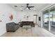 Bright living room with sliding glass doors to outdoor living space at 3859 Spirited Cir, St Cloud, FL 34772