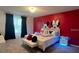 Fun bedroom featuring a themed mural, plush carpet, and decorative pillows at 3878 Lana Ave, Davenport, FL 33897