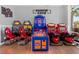 Fun game room featuring a variety of arcade games, including basketball and racing, for entertainment at 3878 Lana Ave, Davenport, FL 33897